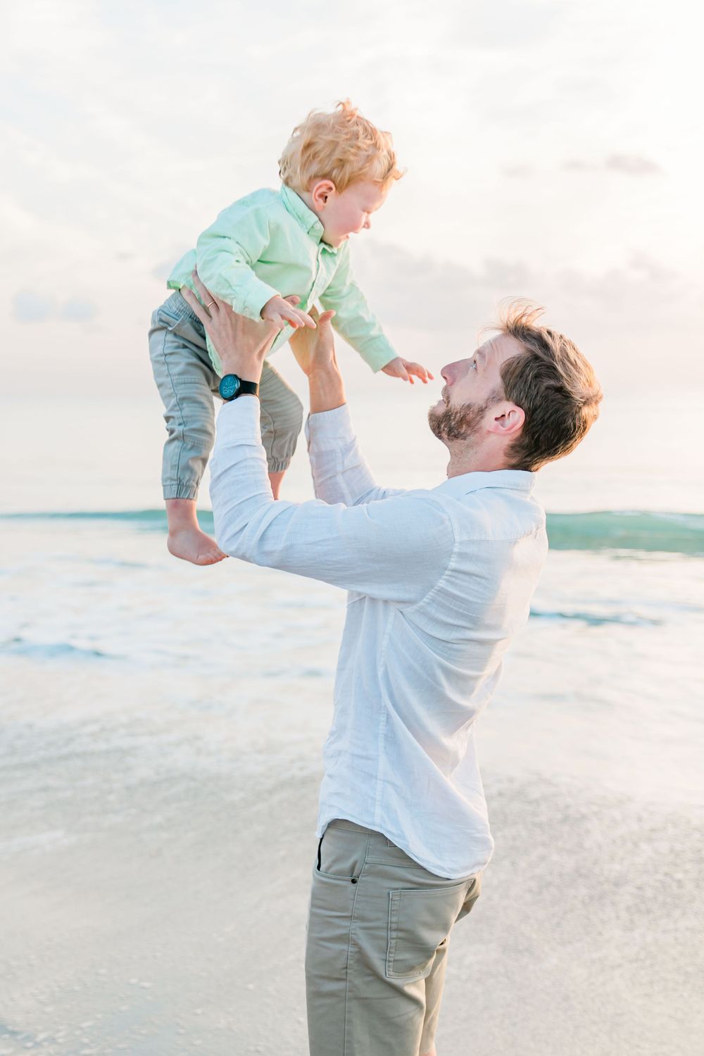 dad lifting son in air, Lifestyle Family Photographer, Melbourne, FL