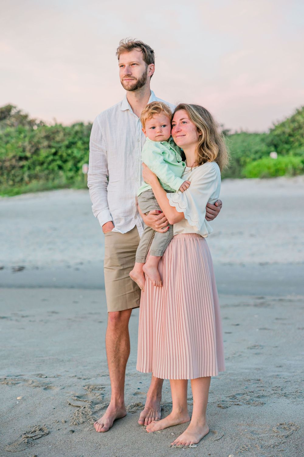 mom, dad, and son looking at sunrise, Lifestyle Family Photographer, Melbourne, FL