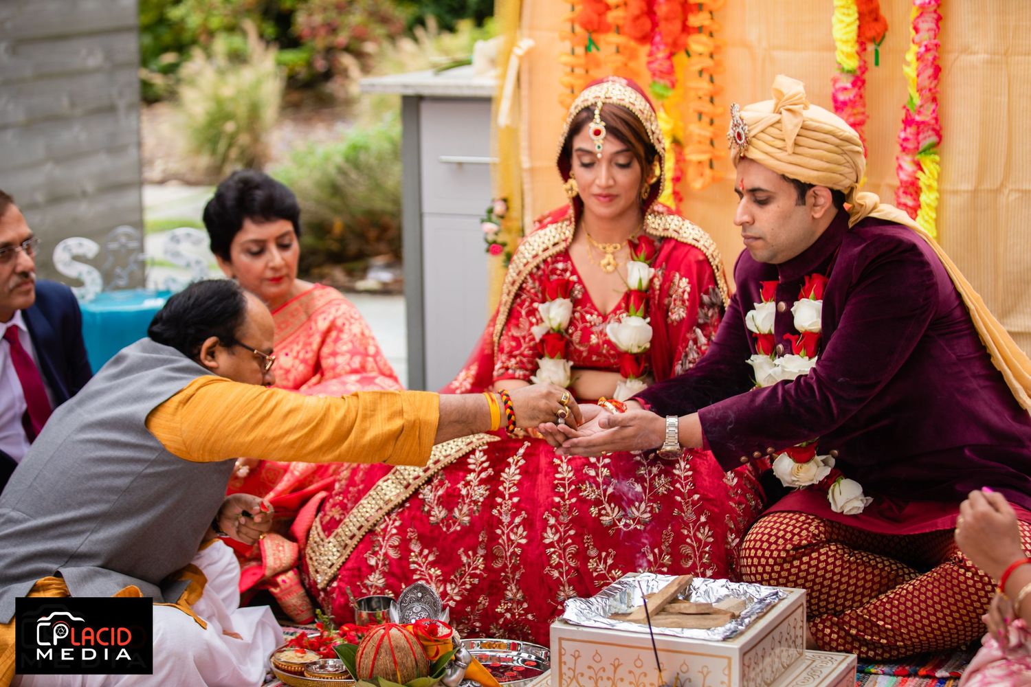 The bride's brother gives three fistfuls of puffed rice to the bride