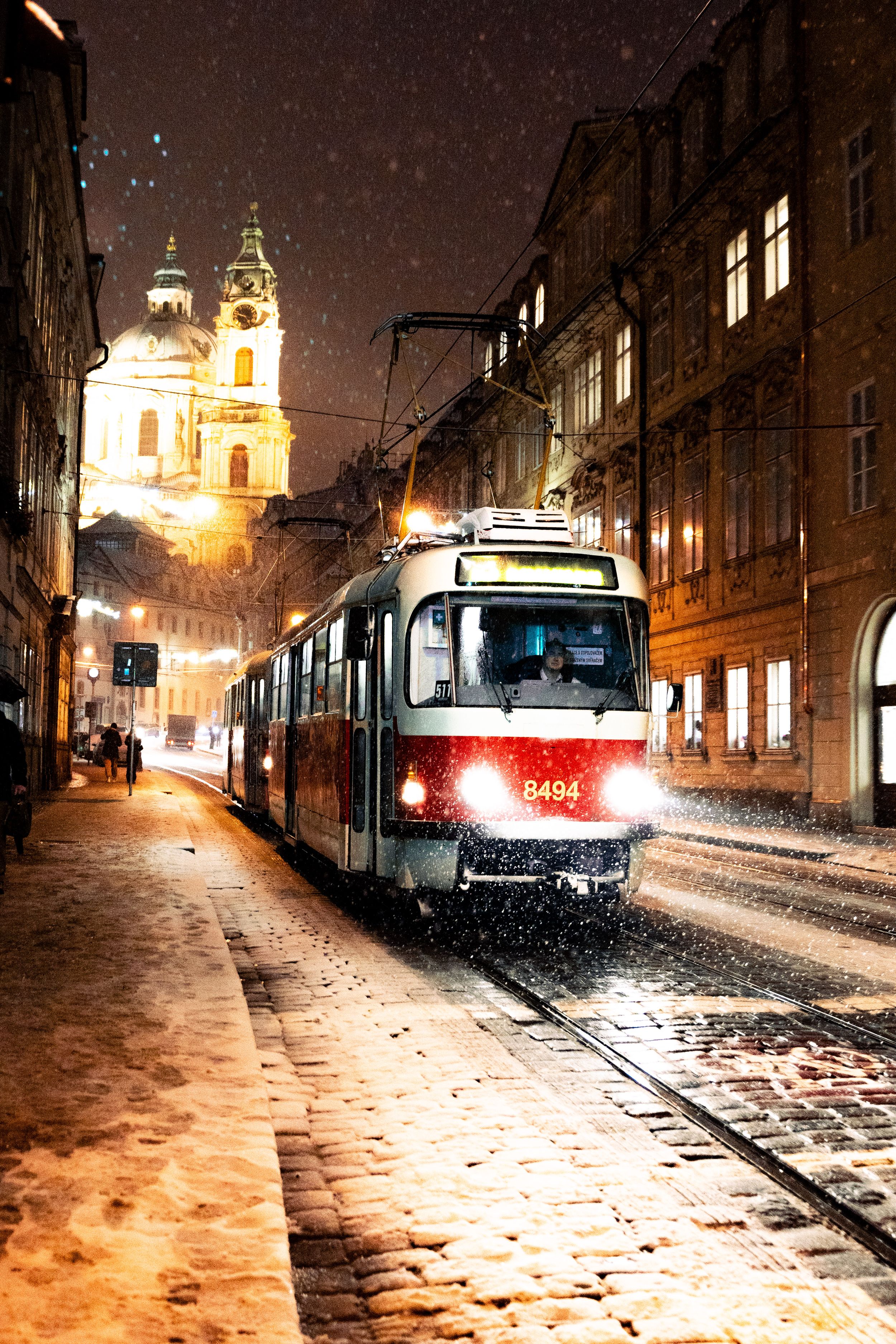 Tram in Prague on a snowy winter night