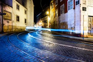 Lisbon, Portugal with trail lights from a car