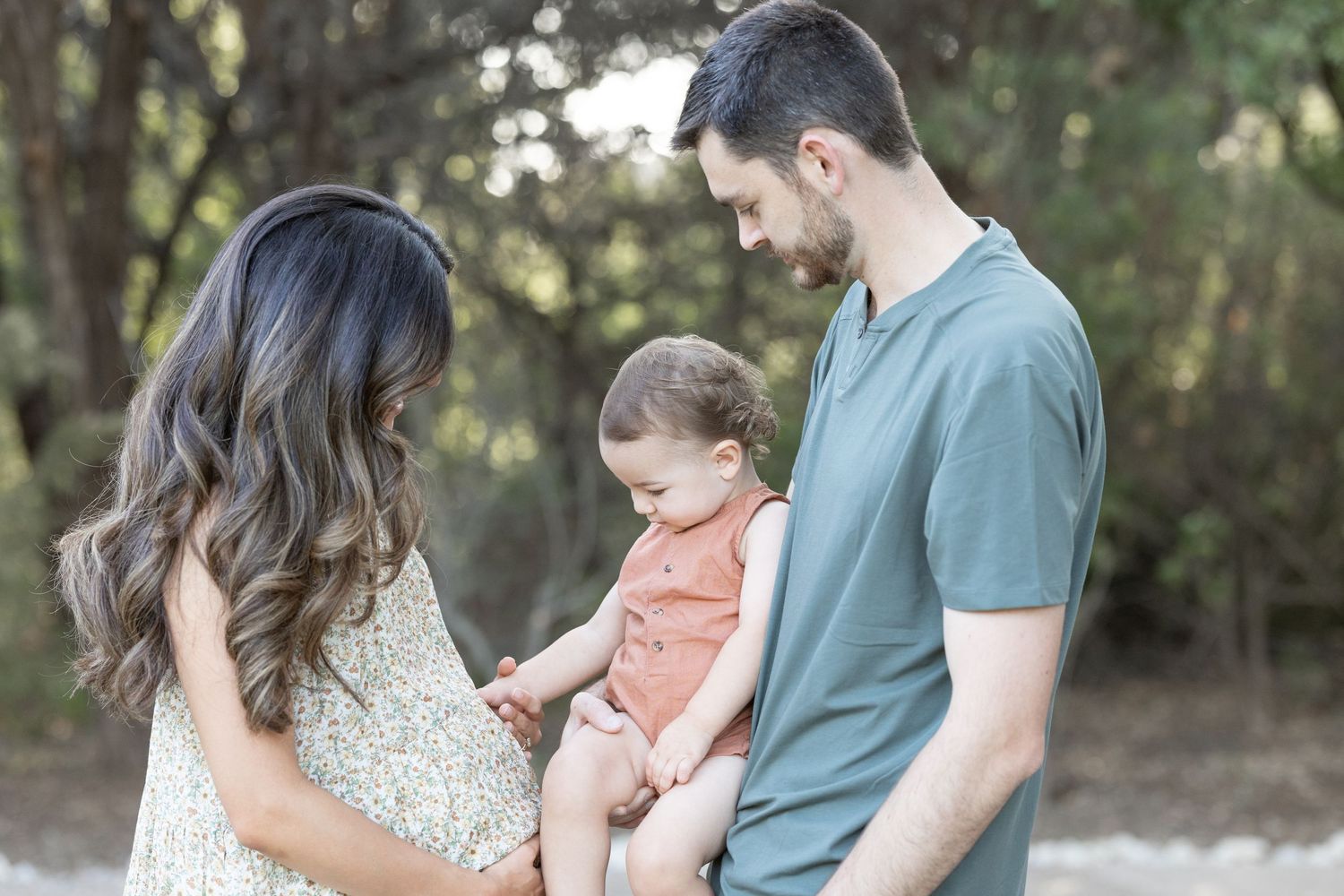 Father, mother, and son are in a maternity photo session photographed by talented Waco Photographer - Blessie MJ Photo