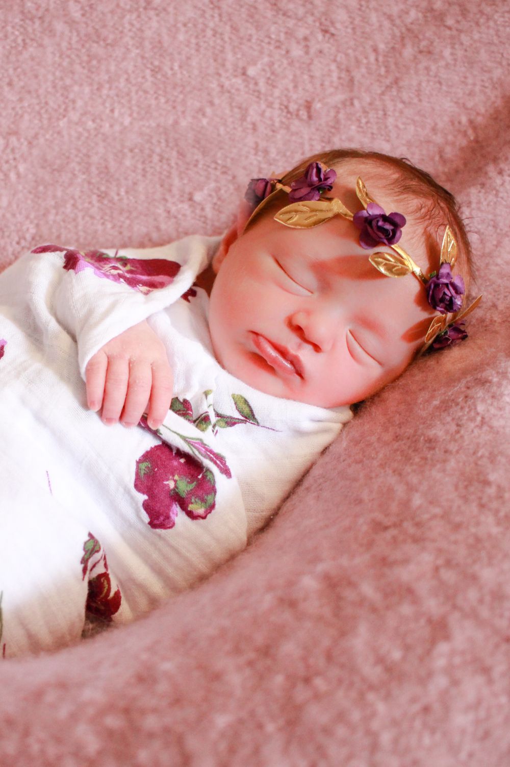 baby girl wrapped in flower blanket flower headband