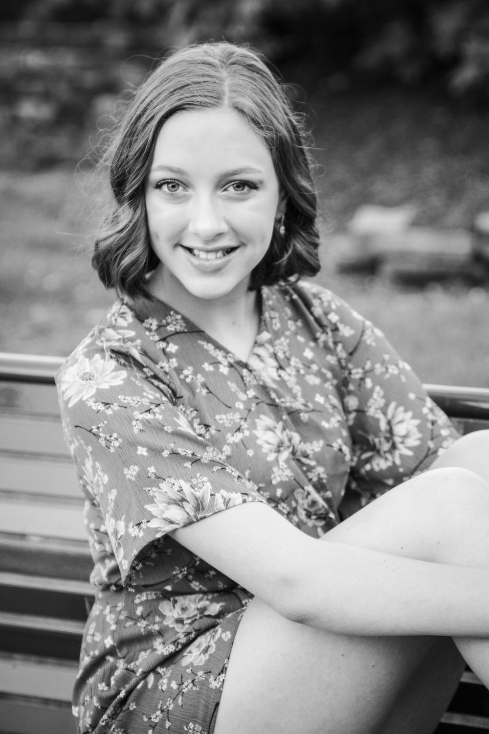 girl laughing over shoulder sitting on steps