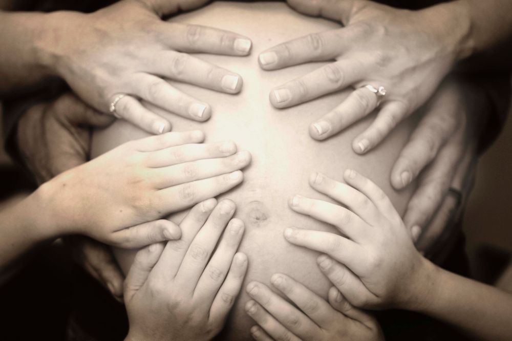 maternity photo of hands on belly