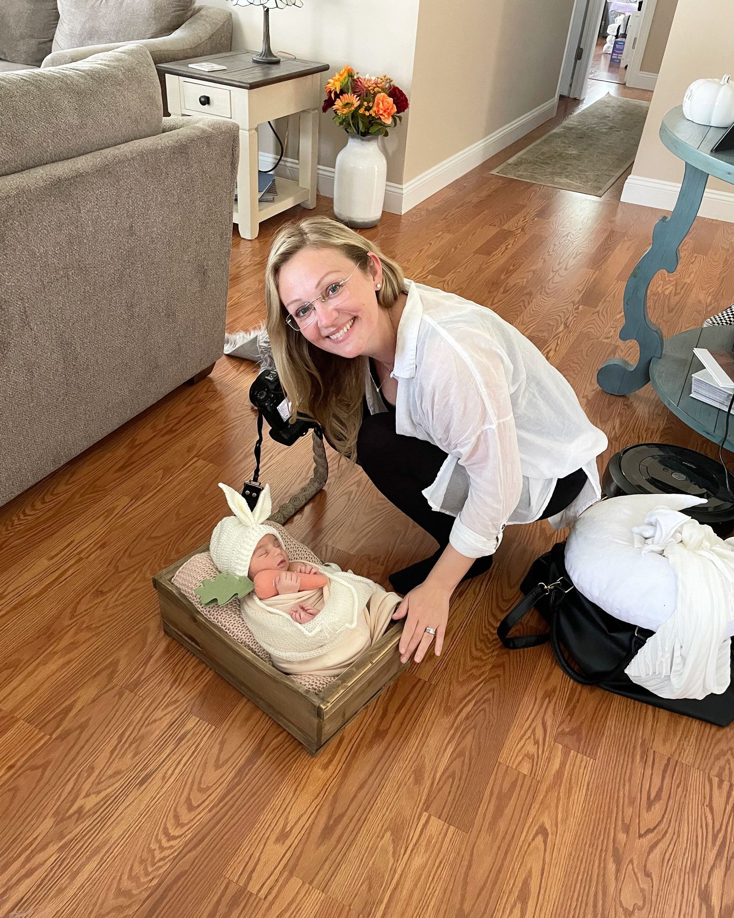 Woman posing with camera and baby