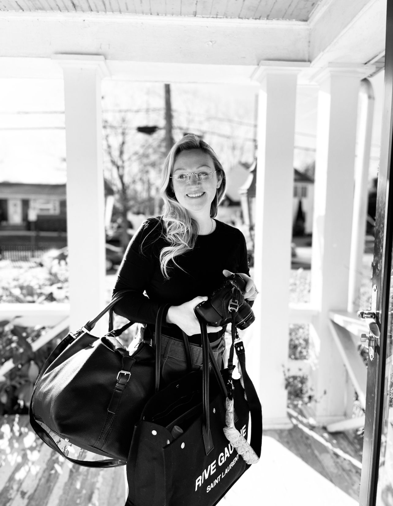 Woman posing with camera gear