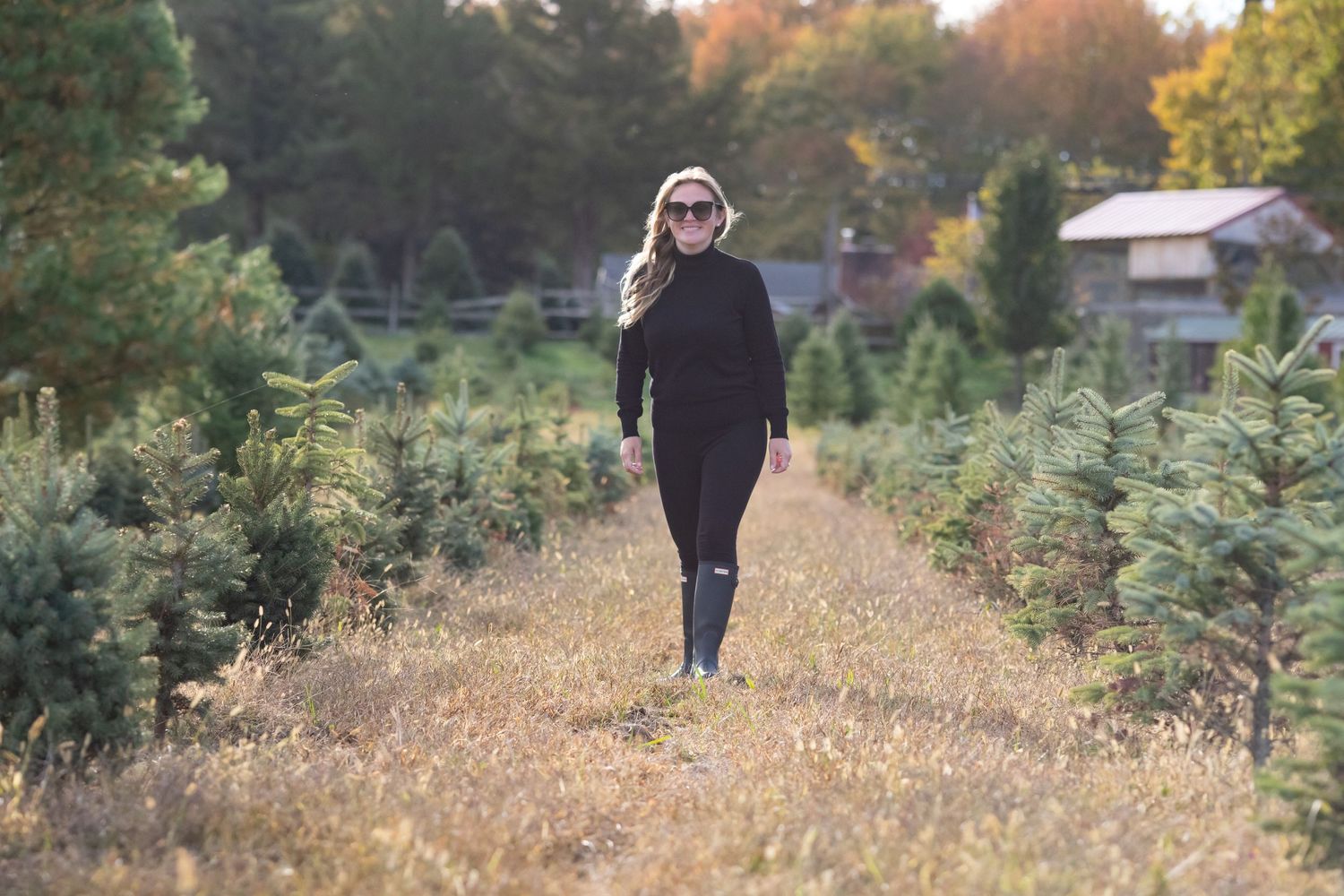 Woman walking in tree farm