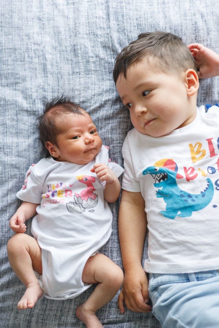 Newborn baby and older brother matching outfits