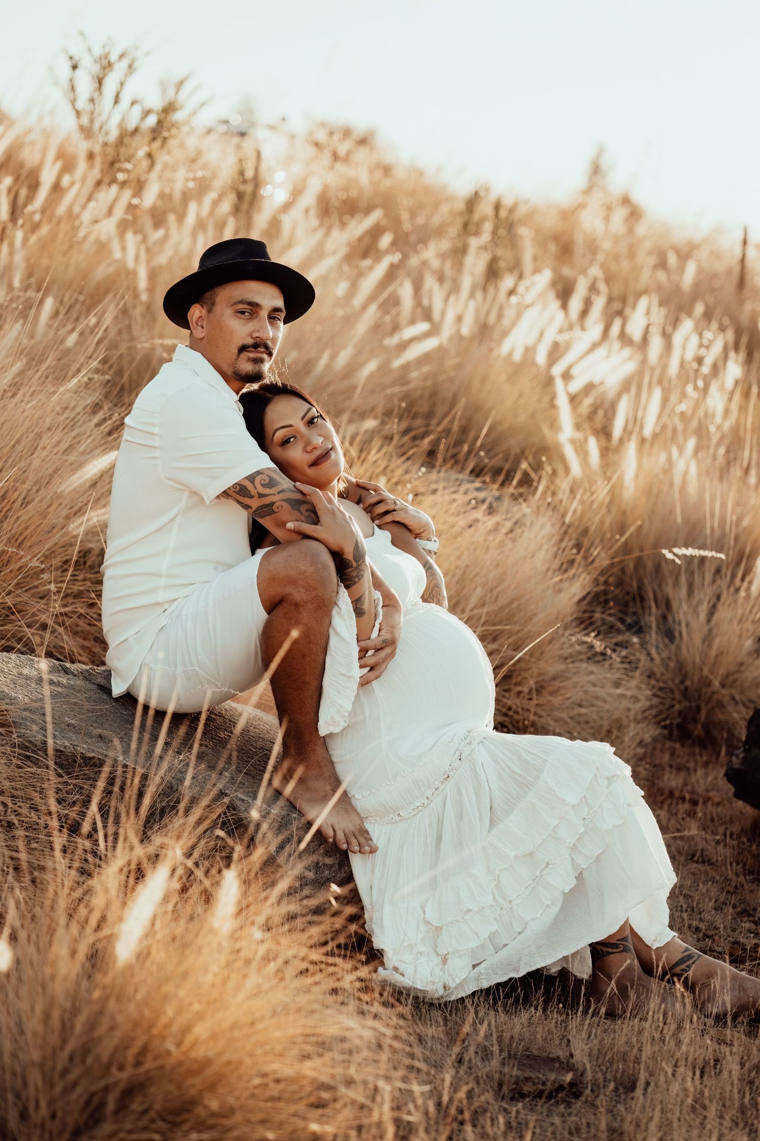 Maternity photoshoot in Perth at sunset, dressed timelessly in white flowy maternity dress and adorned in bunny tails.