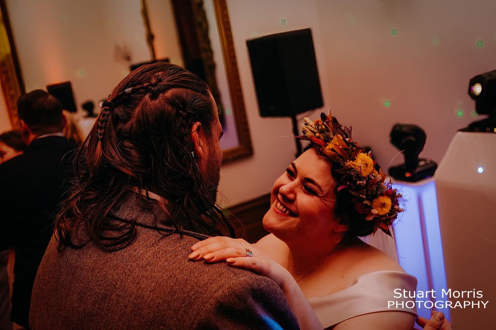 bride smiling at the groom during the first dance. ruthin castle wedding. Stuart Morris Photography