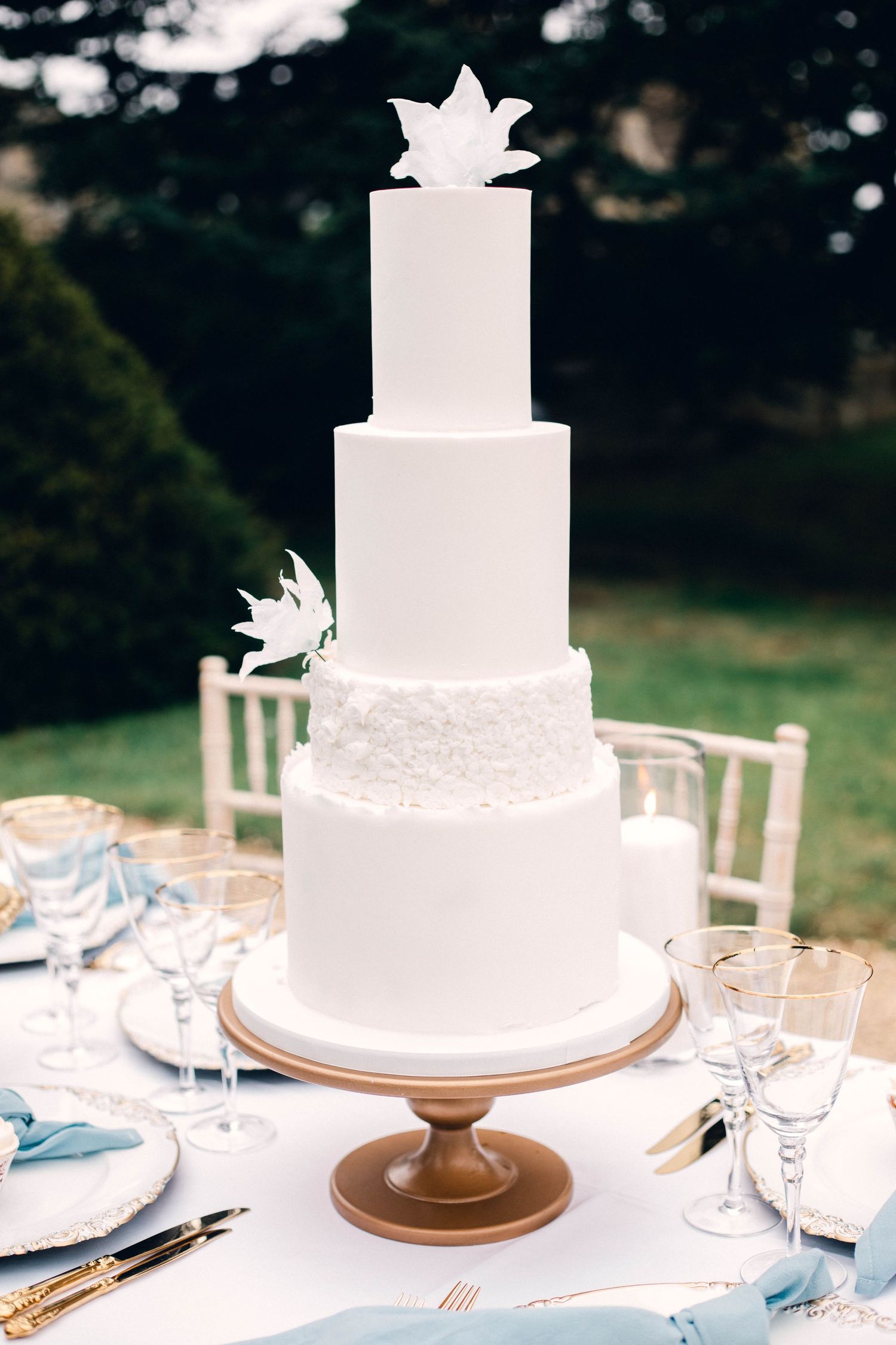 delicate wedding cake outdoor reception summer luxury wedding