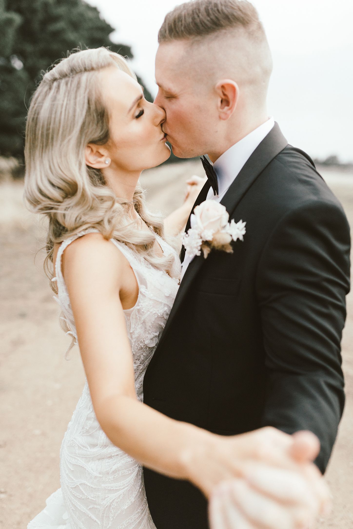 An intimate wedding portrait showing a romantic moment between newlyweds.