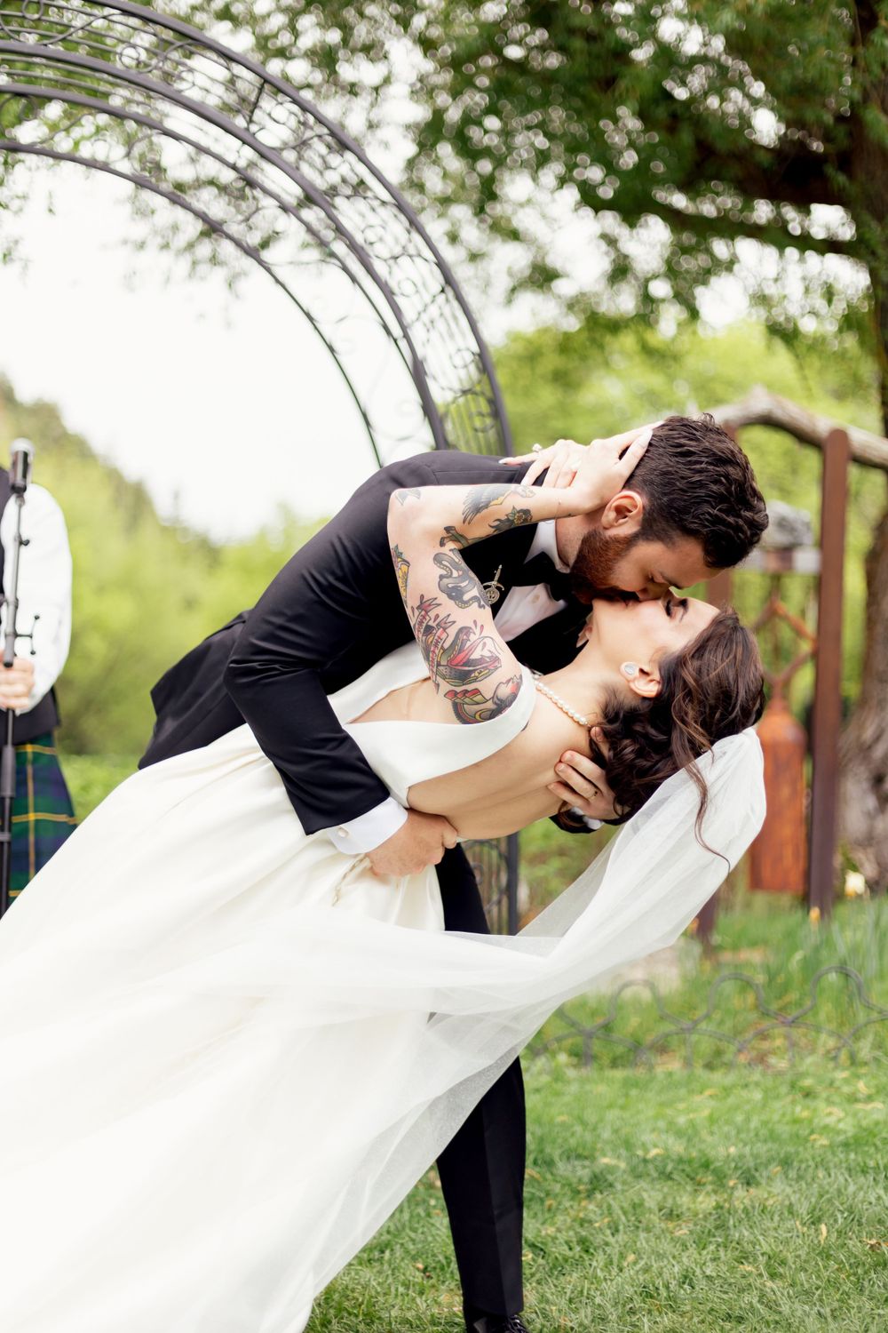 bride and groom kiss passionately at wedding ceremony in missouri