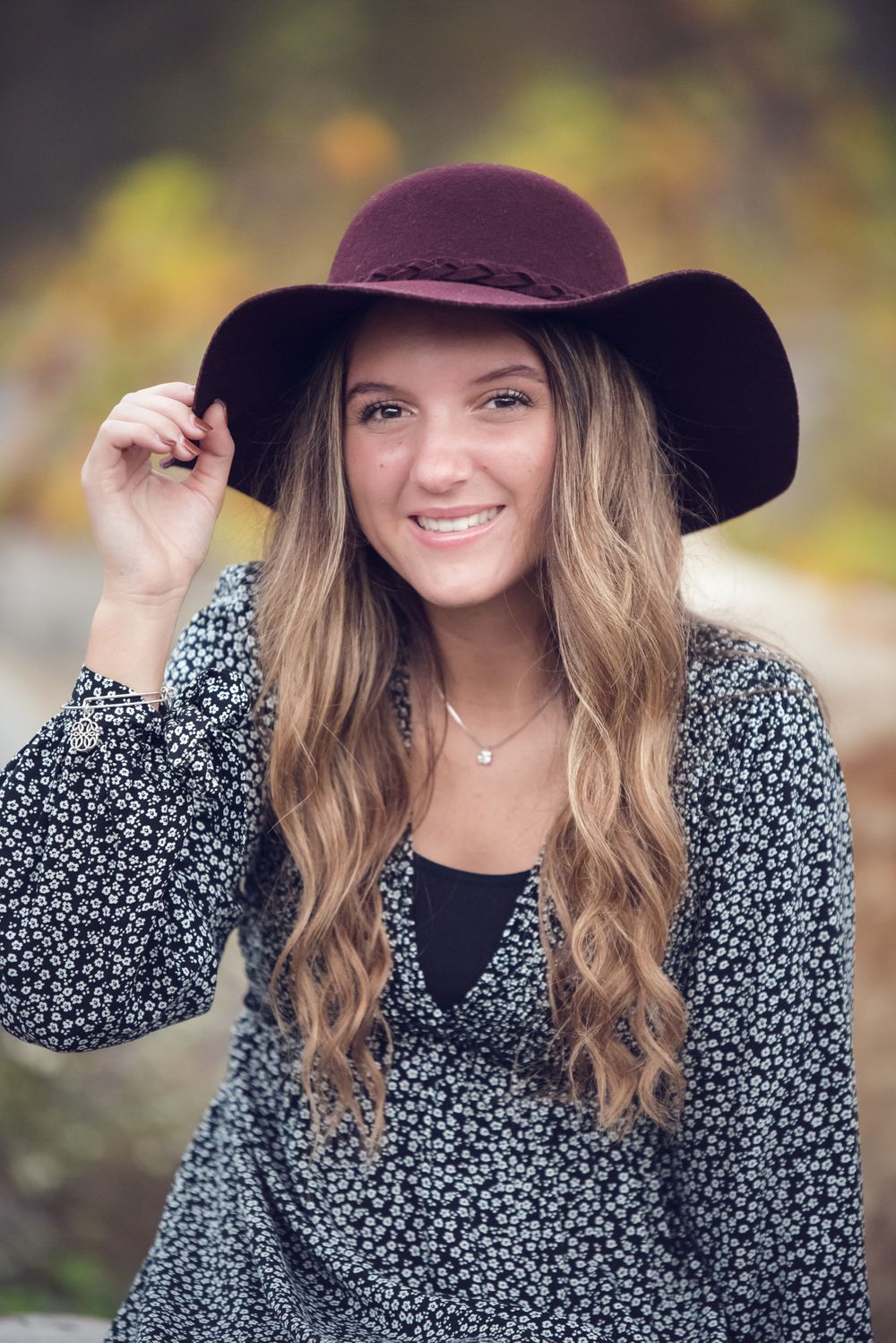 senior girl fall pictures with cute floral dress and hat