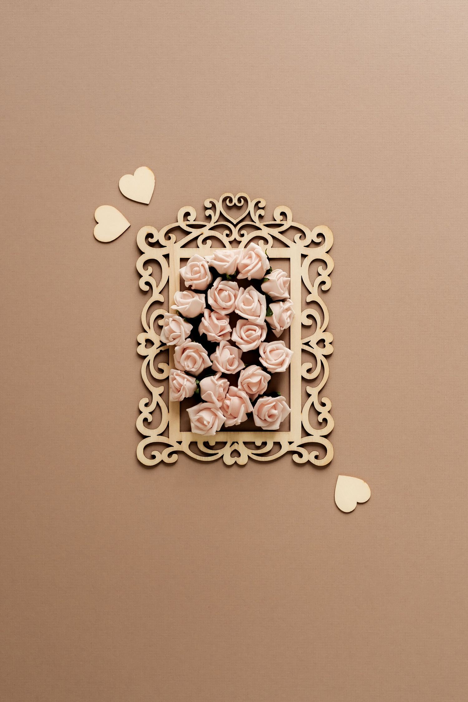 roses in a decorative wooden frame on a beige backdrop with hearts, romantic stock photos, feminine