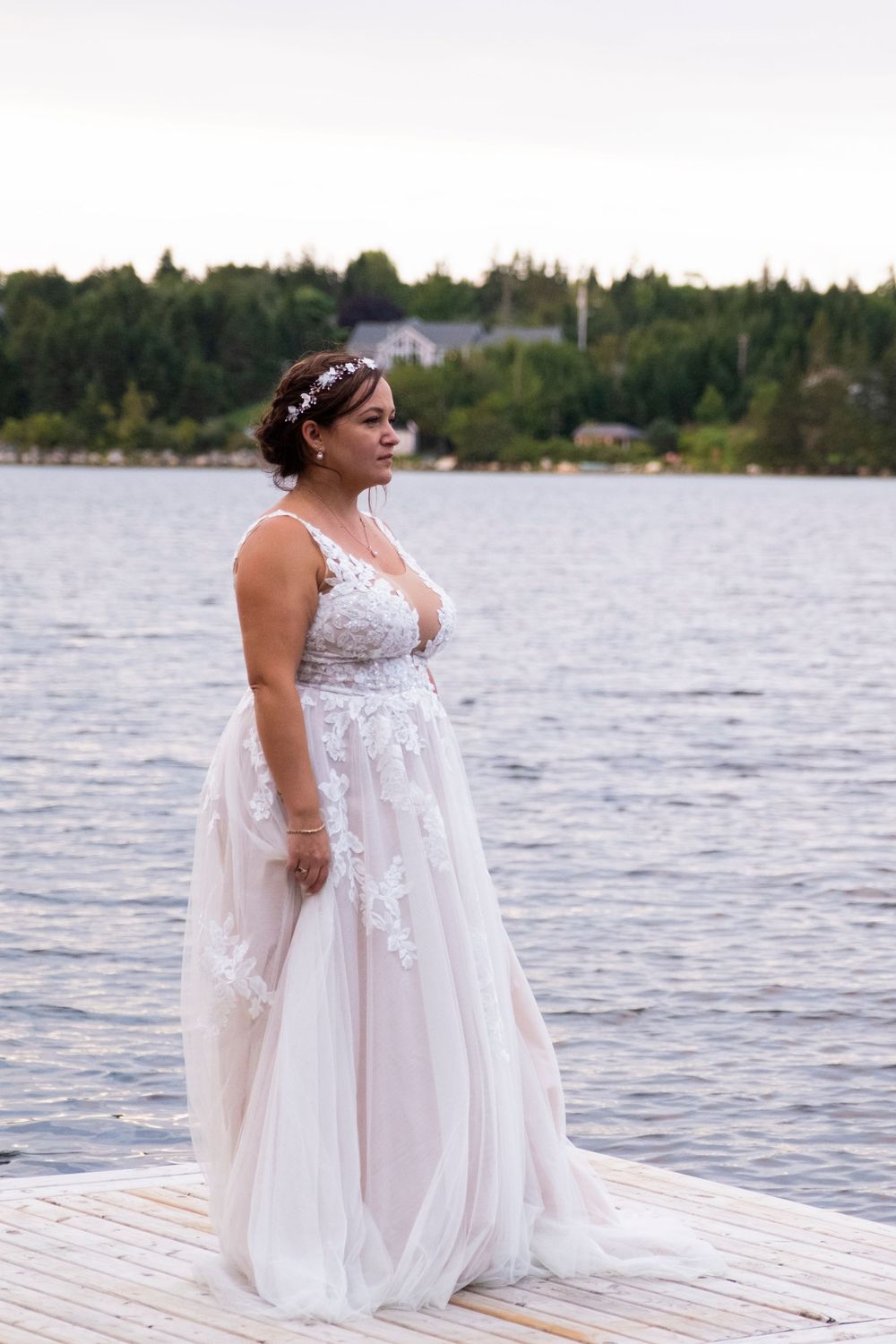 Bride standing on dock