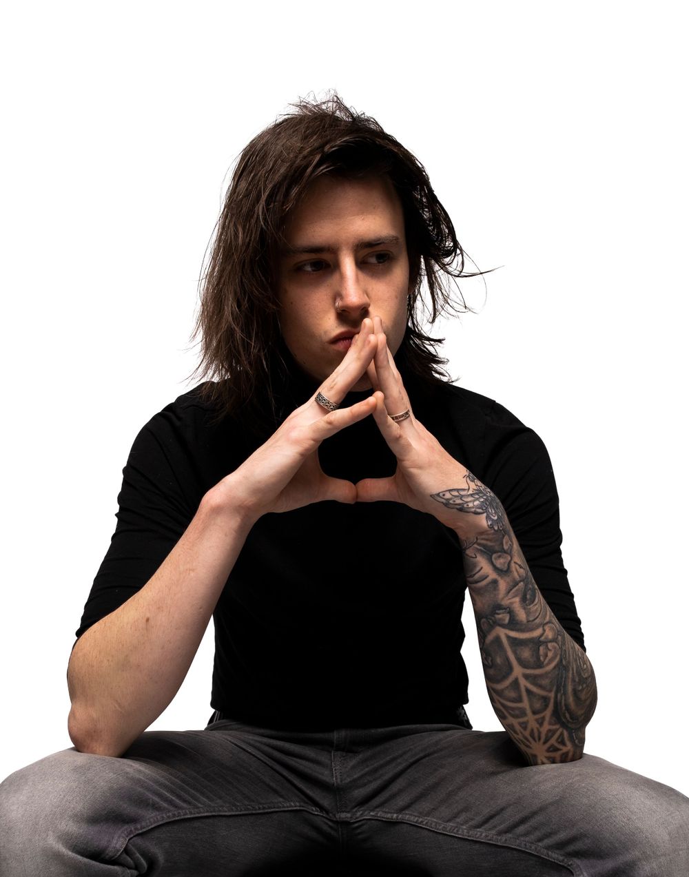 Man sitting with hands together