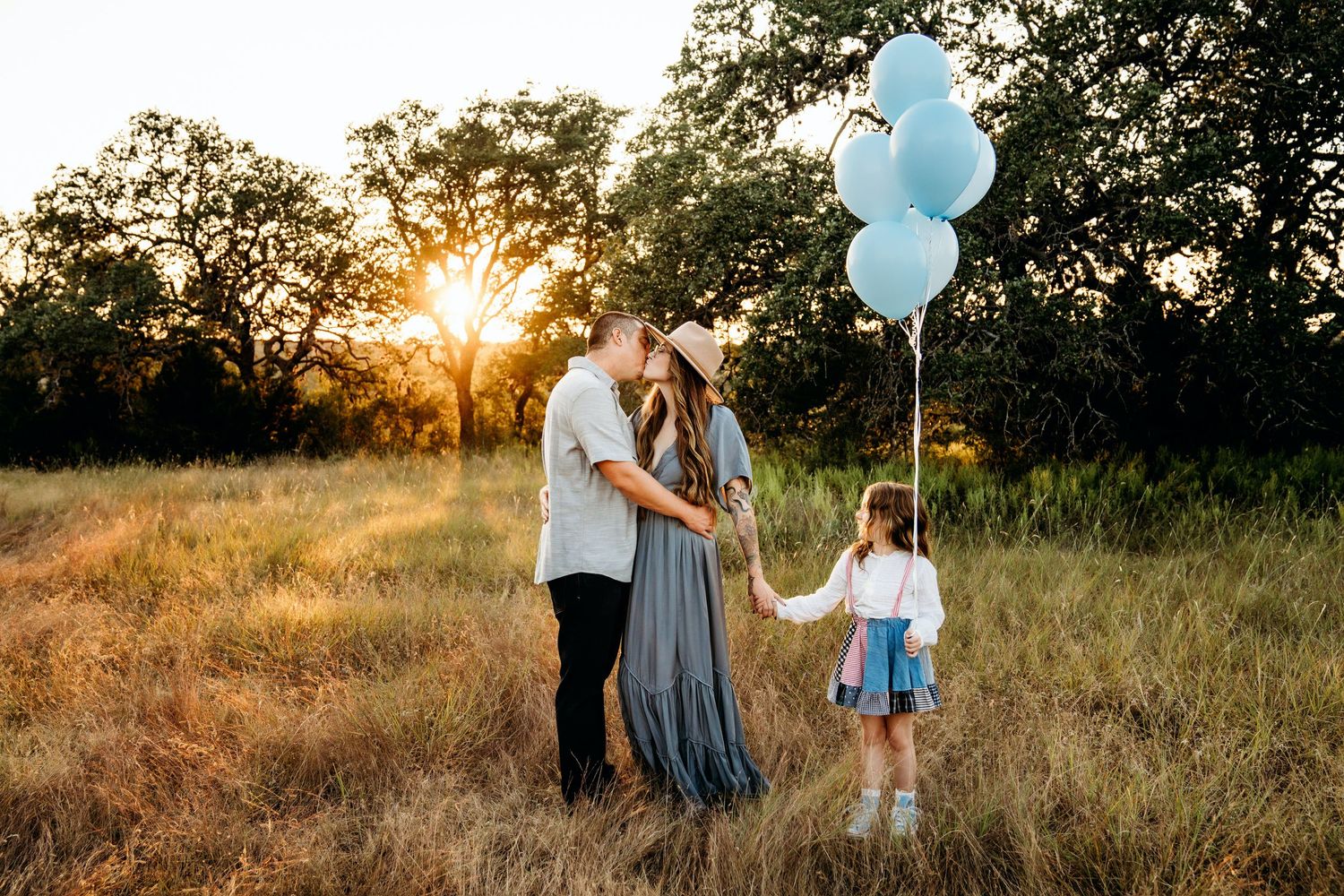 albertvphotos, family of 3 playing together and parents kissing