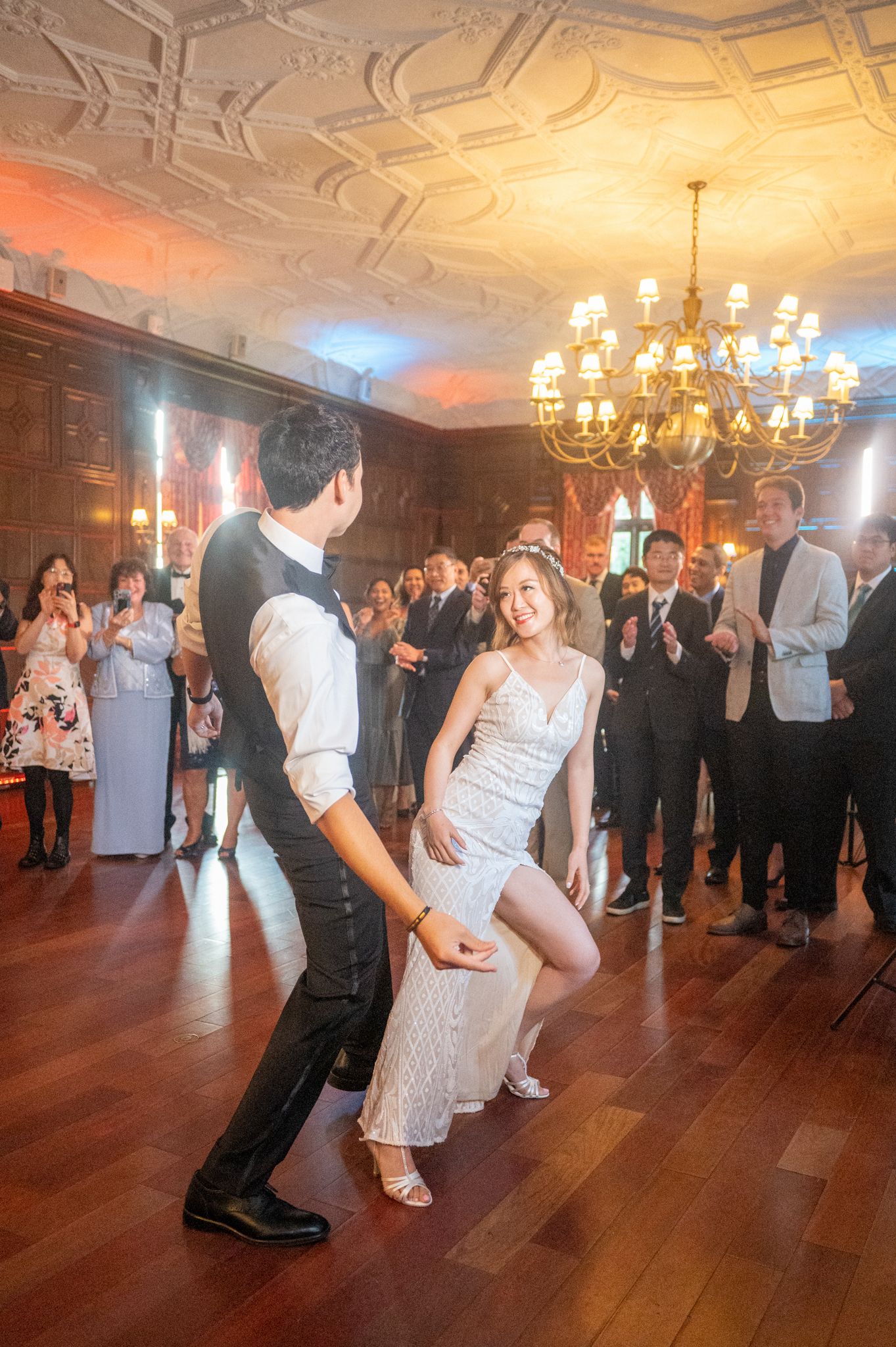 Joyful couple dancing at their NYIT reception party.