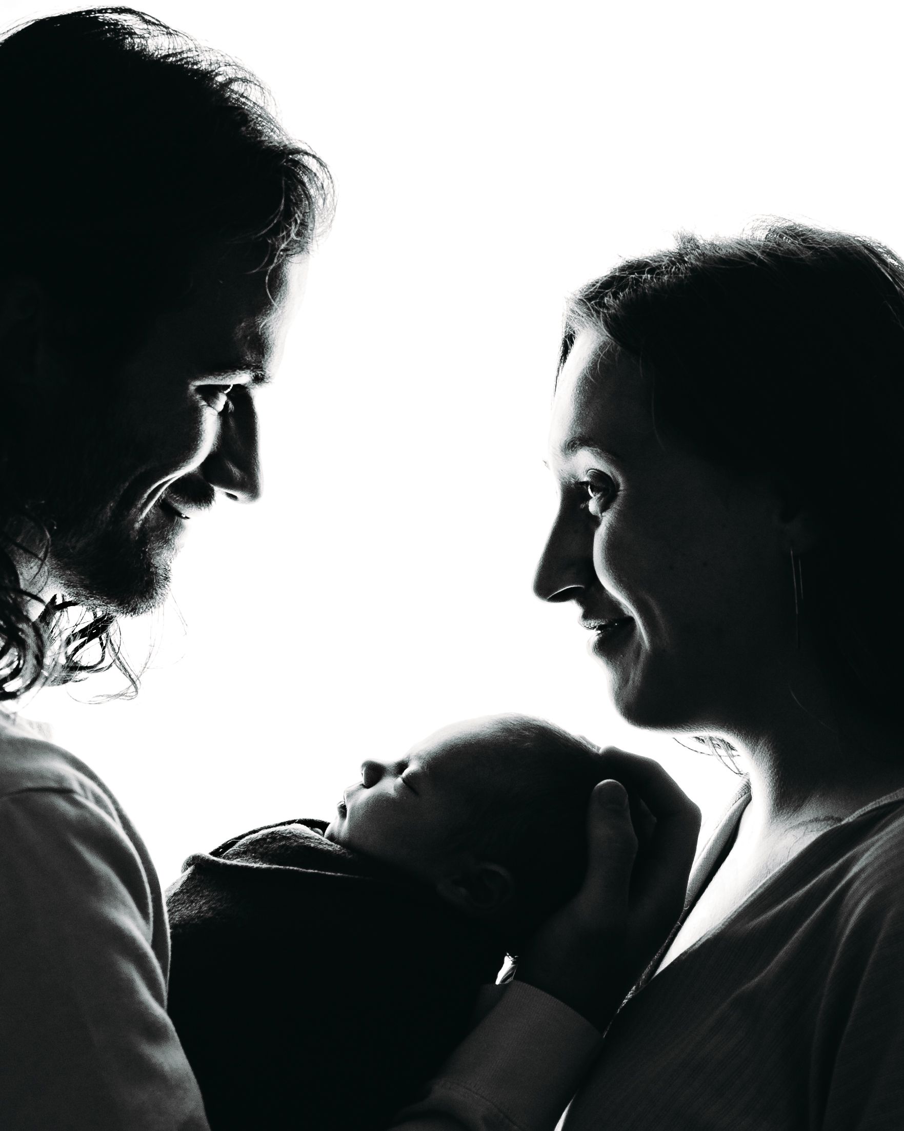 Professional newborn photo with mom and dad