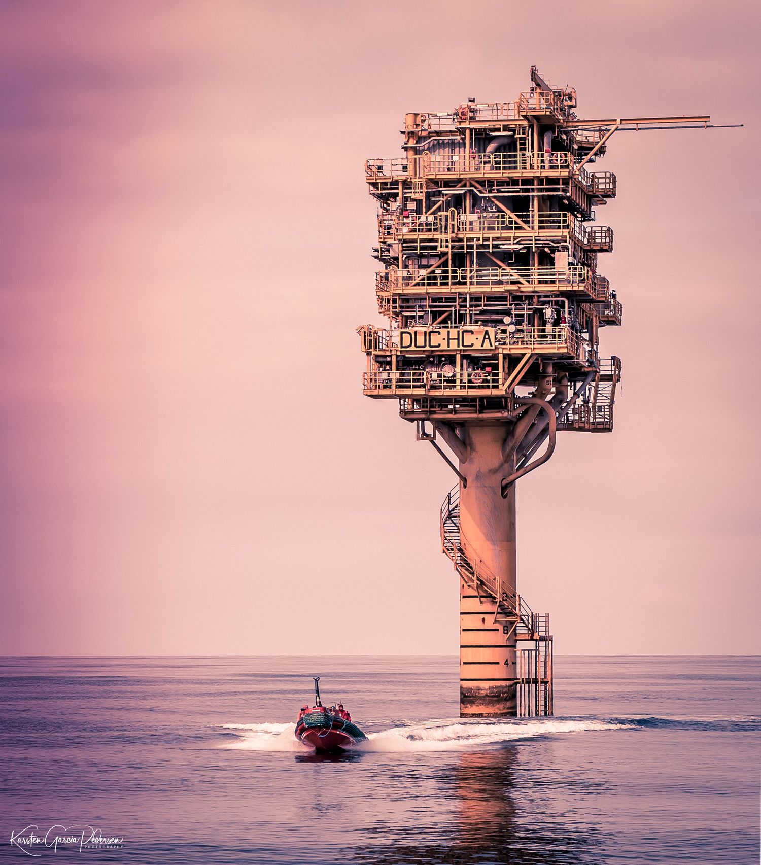 Offshore Maintenance & ect. workers, on they duty by boat to a satellite platform. Northsea. Sunset Northsee