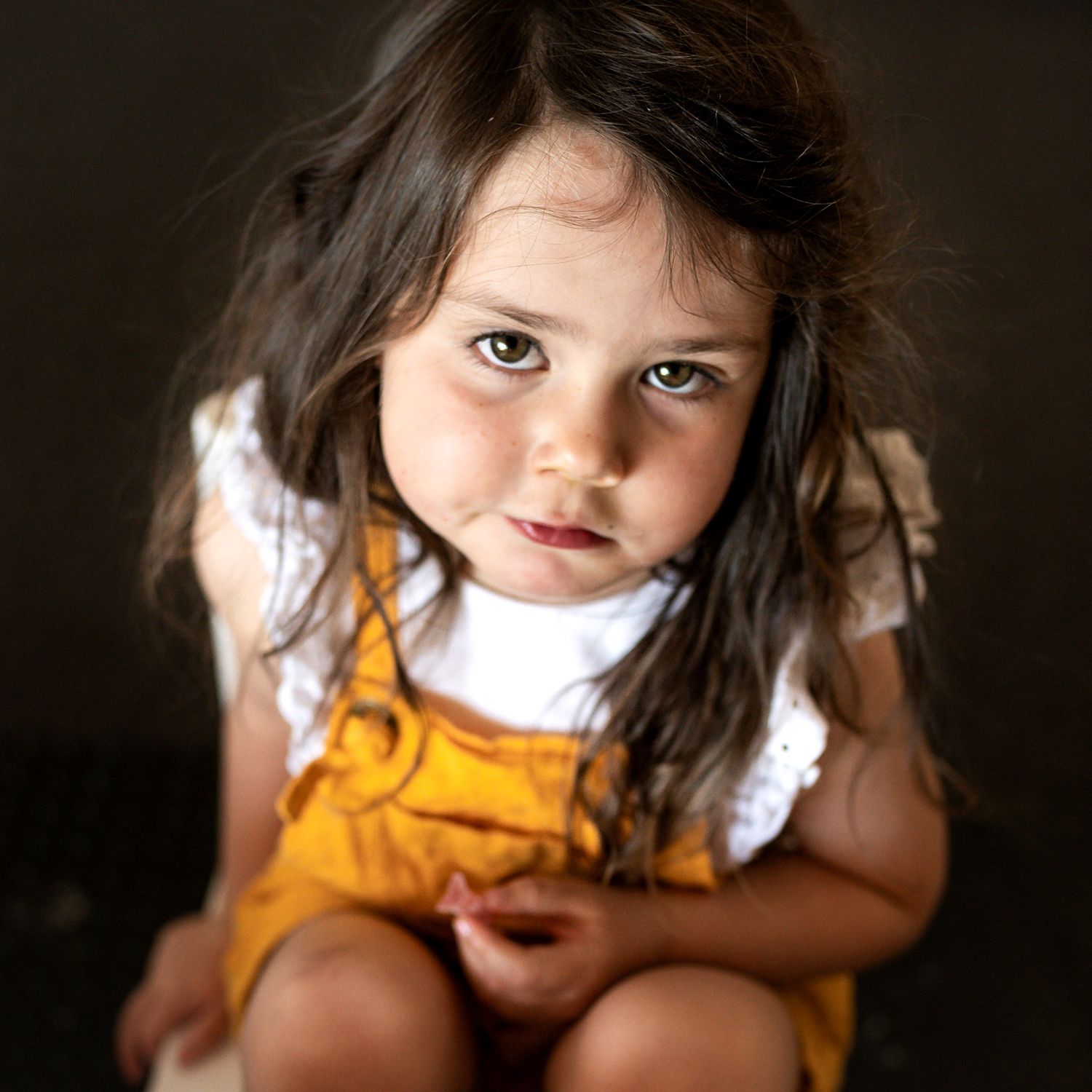 Toddler looking bored into the camera