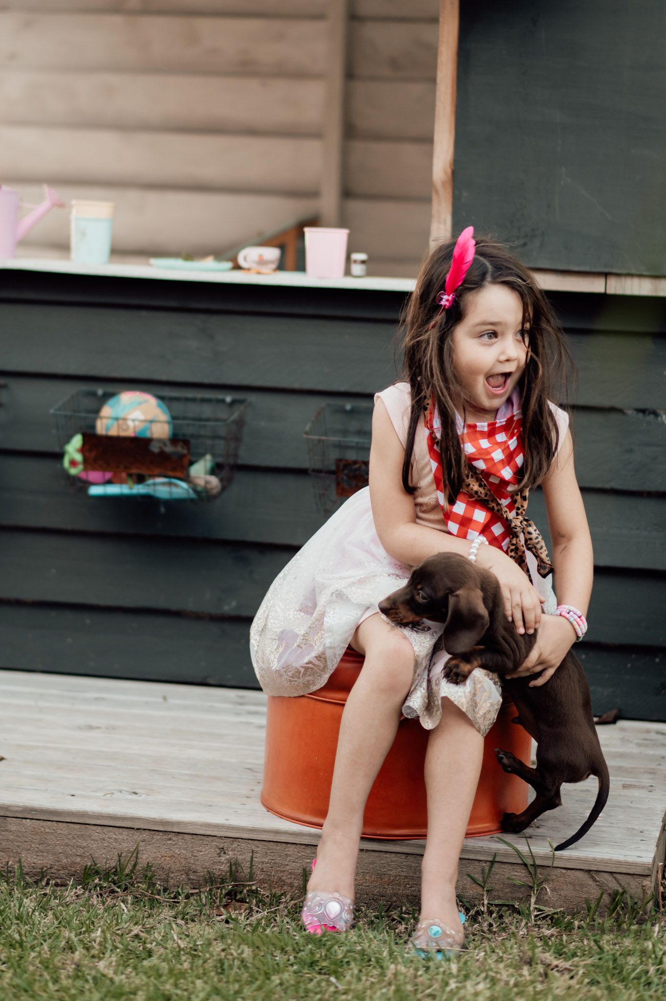 Isla and Milo the dog who is nearly being dropped