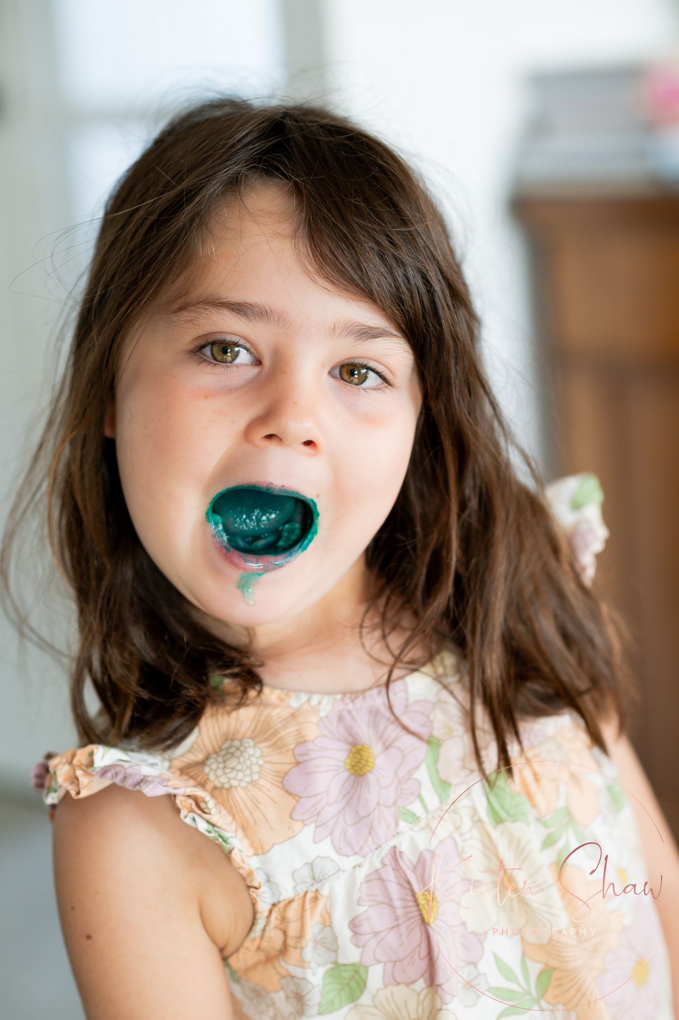 Isla after sucking on a blue pen with her mouth full of blue ink