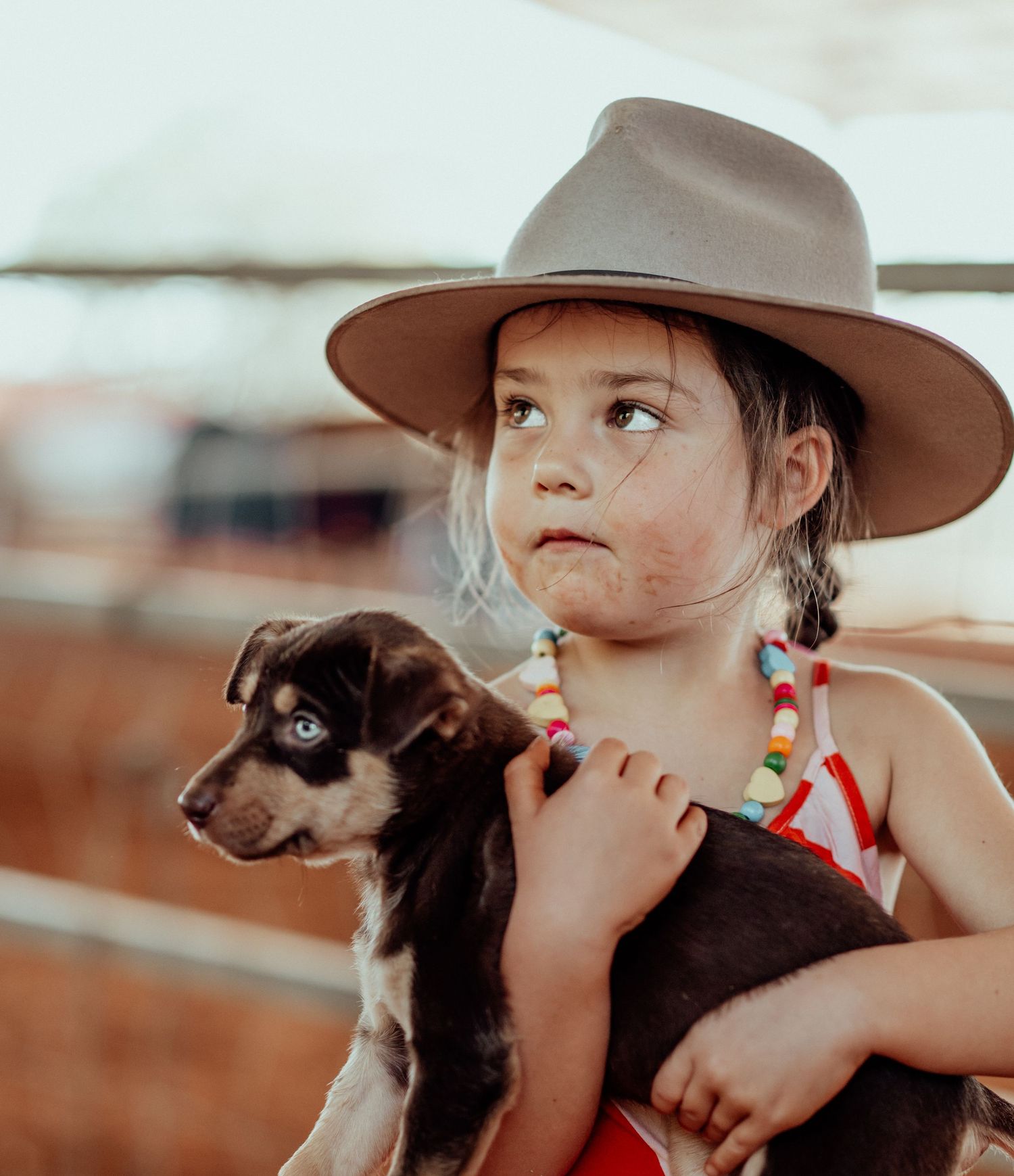 Isla holding a kelpie puppy