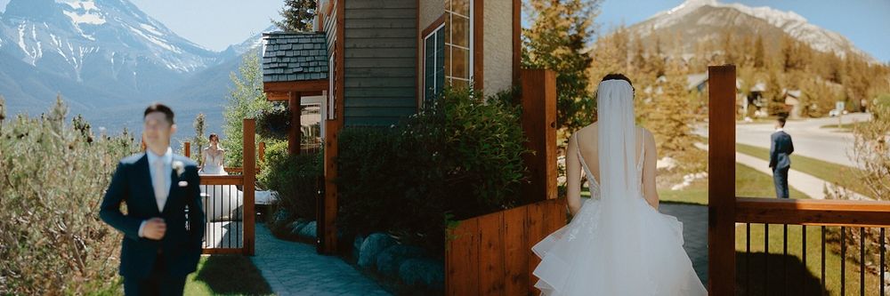 Panoramic view of mountain lodge wedding venue surrounded by peaks.