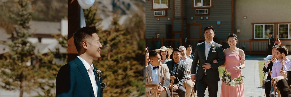 Guests seated in wooden chairs watch an outdoor mountain wedding ceremony.