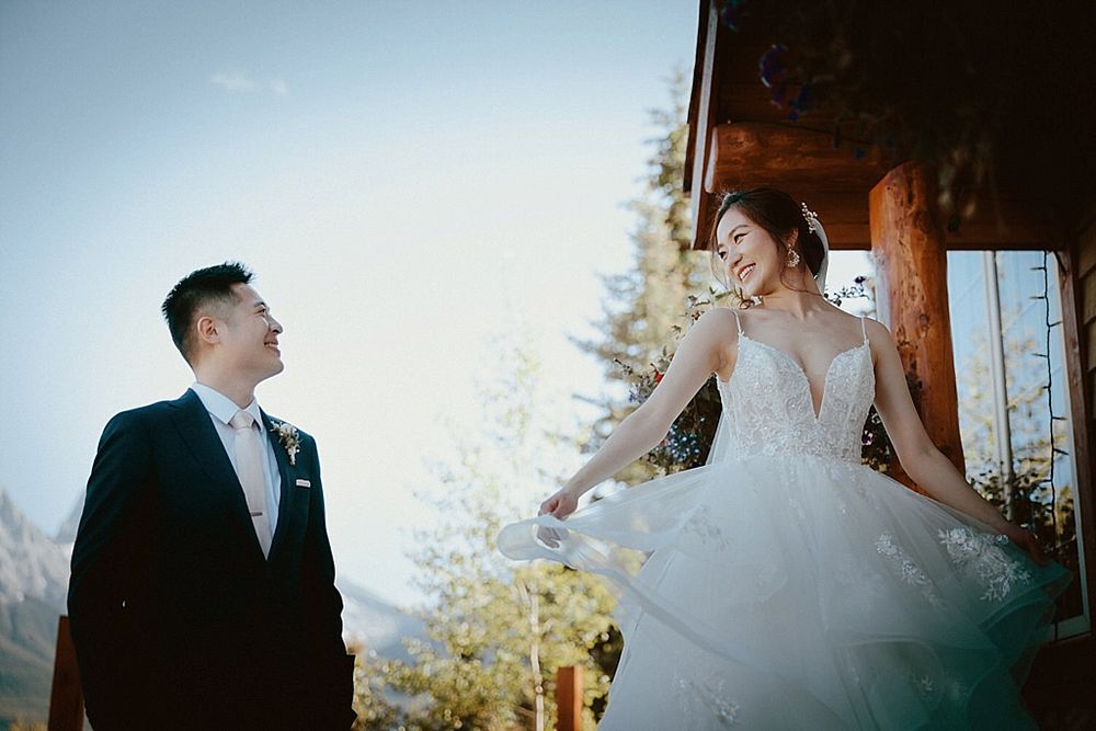 Candid wedding moments photographed against mountain backdrop at golden hour.