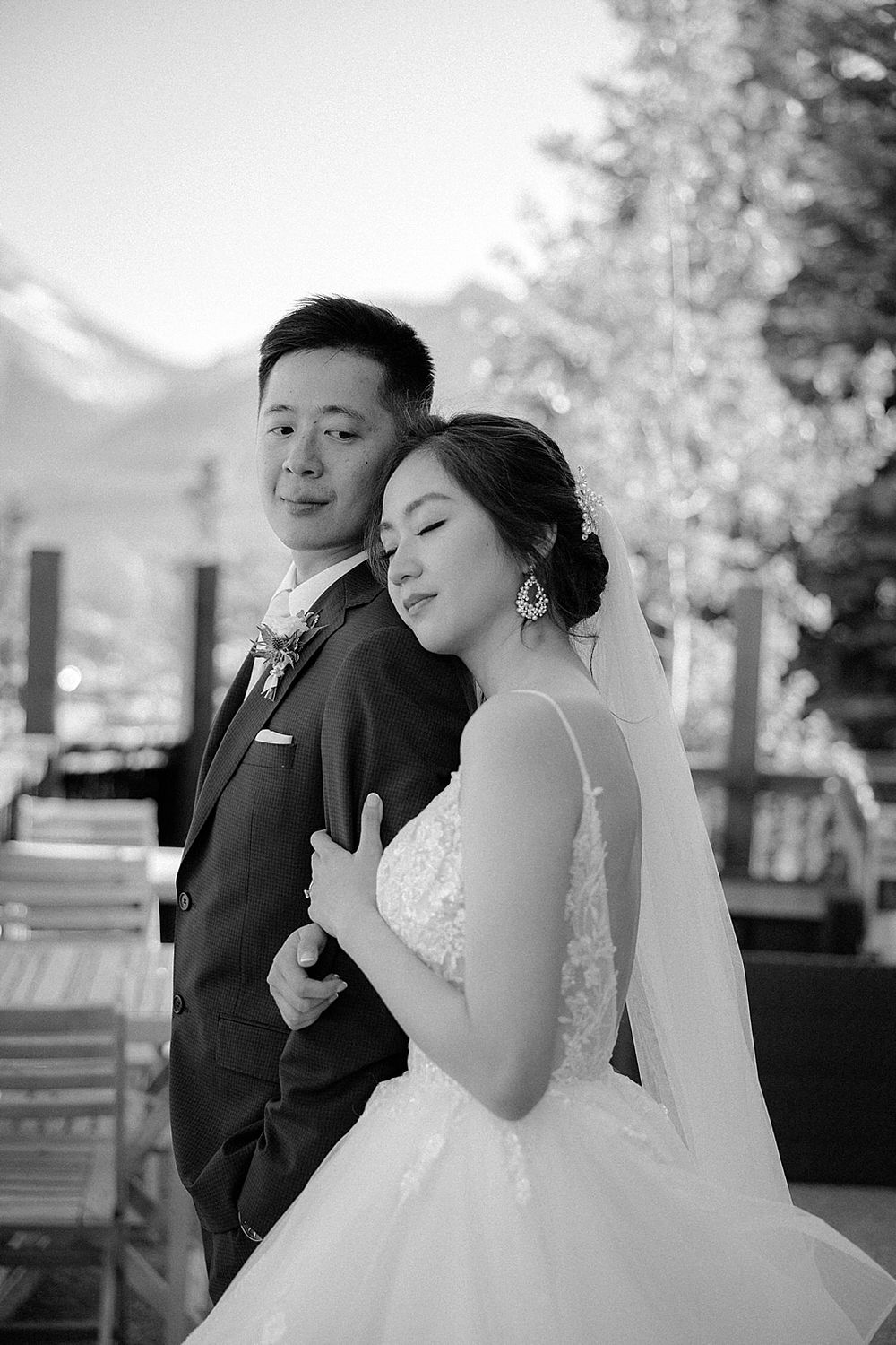 Black and white portraits capturing emotional wedding moments against a natural backdrop.