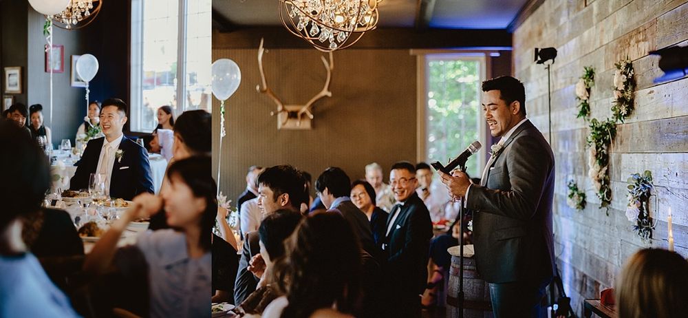 Elegant chandeliers illuminate a rustic venue during a wedding reception celebration.