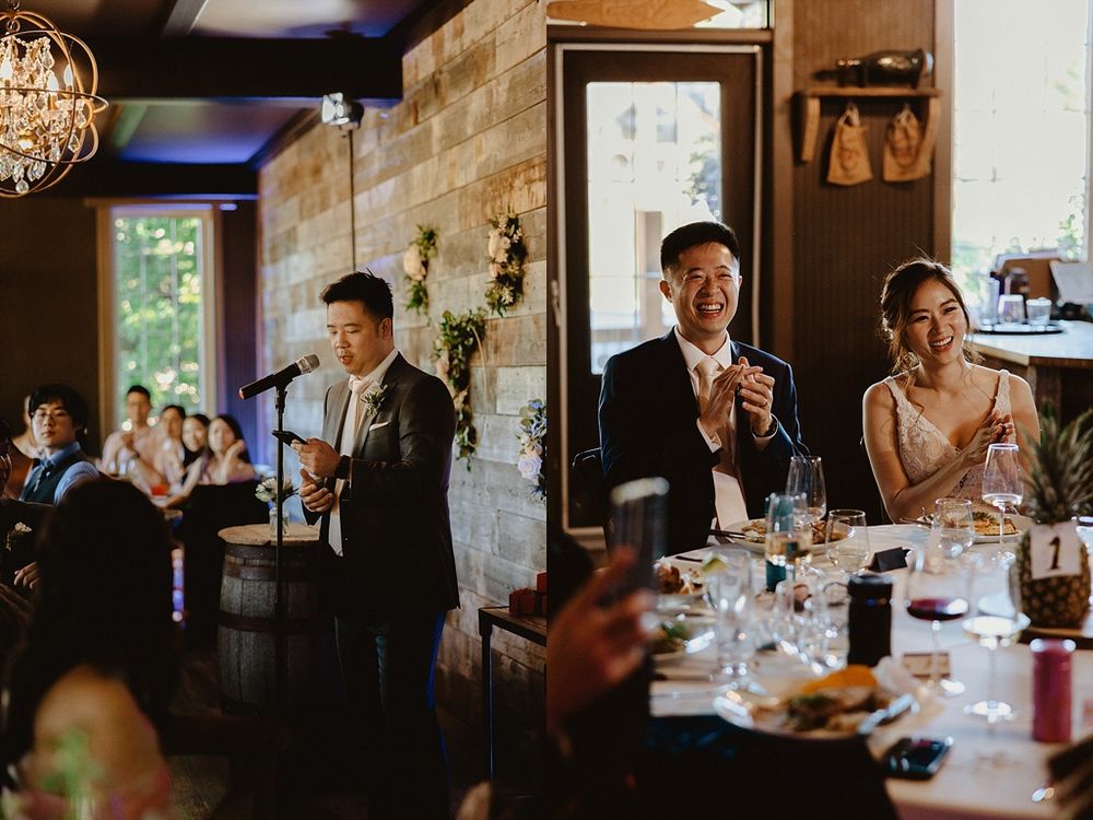 Intimate wedding reception gathering in a cozy restaurant setting with rustic wood walls.
