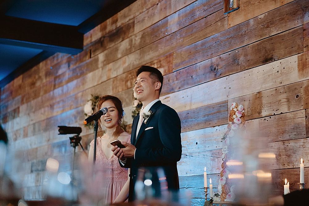 Romantic evening celebration scene with exposed brick walls and dramatic lighting.