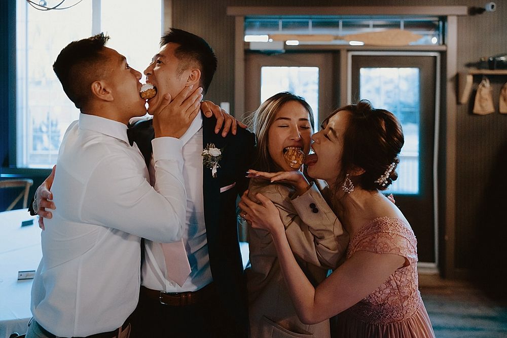 Romantic dance moments during wedding reception in dimly lit venue.