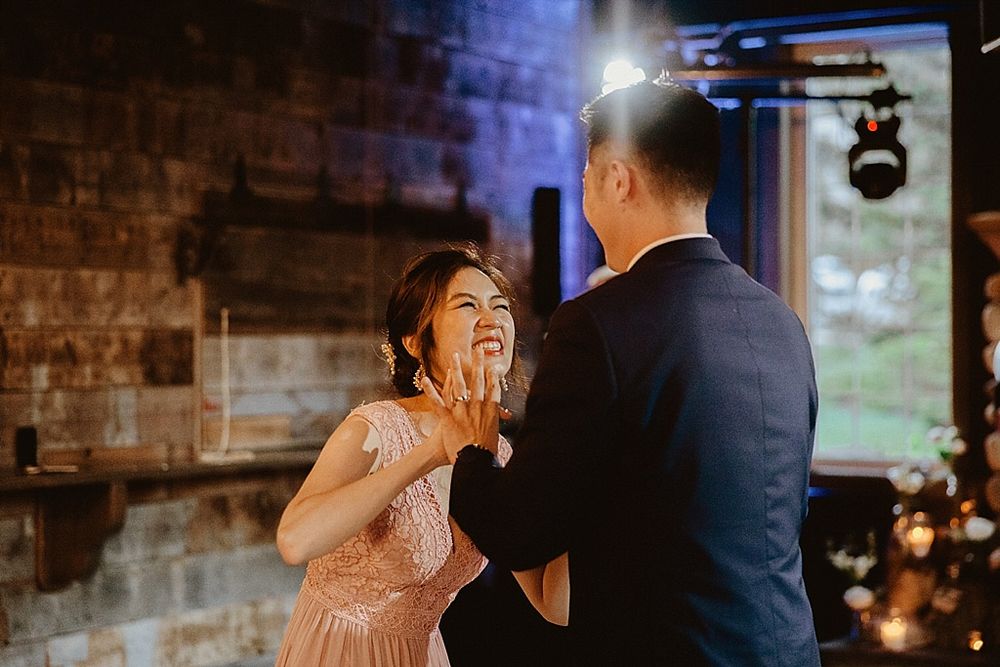 Expressive dance movements captured in a romantic venue setting with mood lighting.