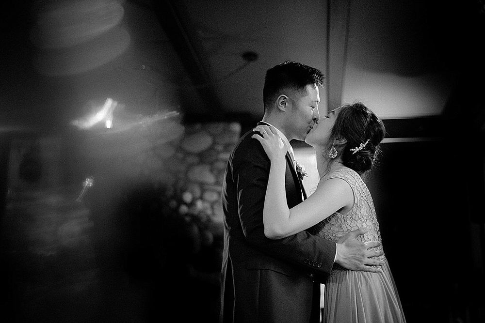 Black and white dance sequence showing graceful movement in dramatic lighting.