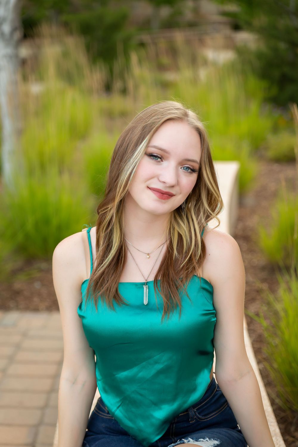 senior girl wearing green top closeup