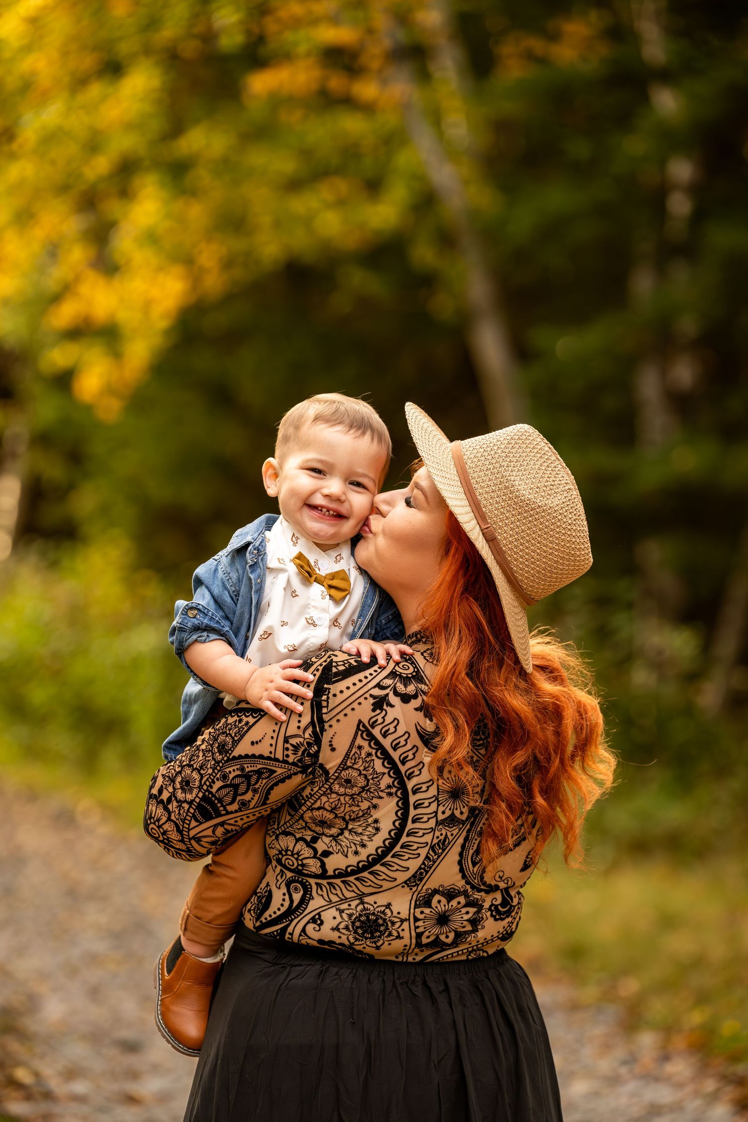 Autumn outdoor portrait in a forest with fall foliage in the background.