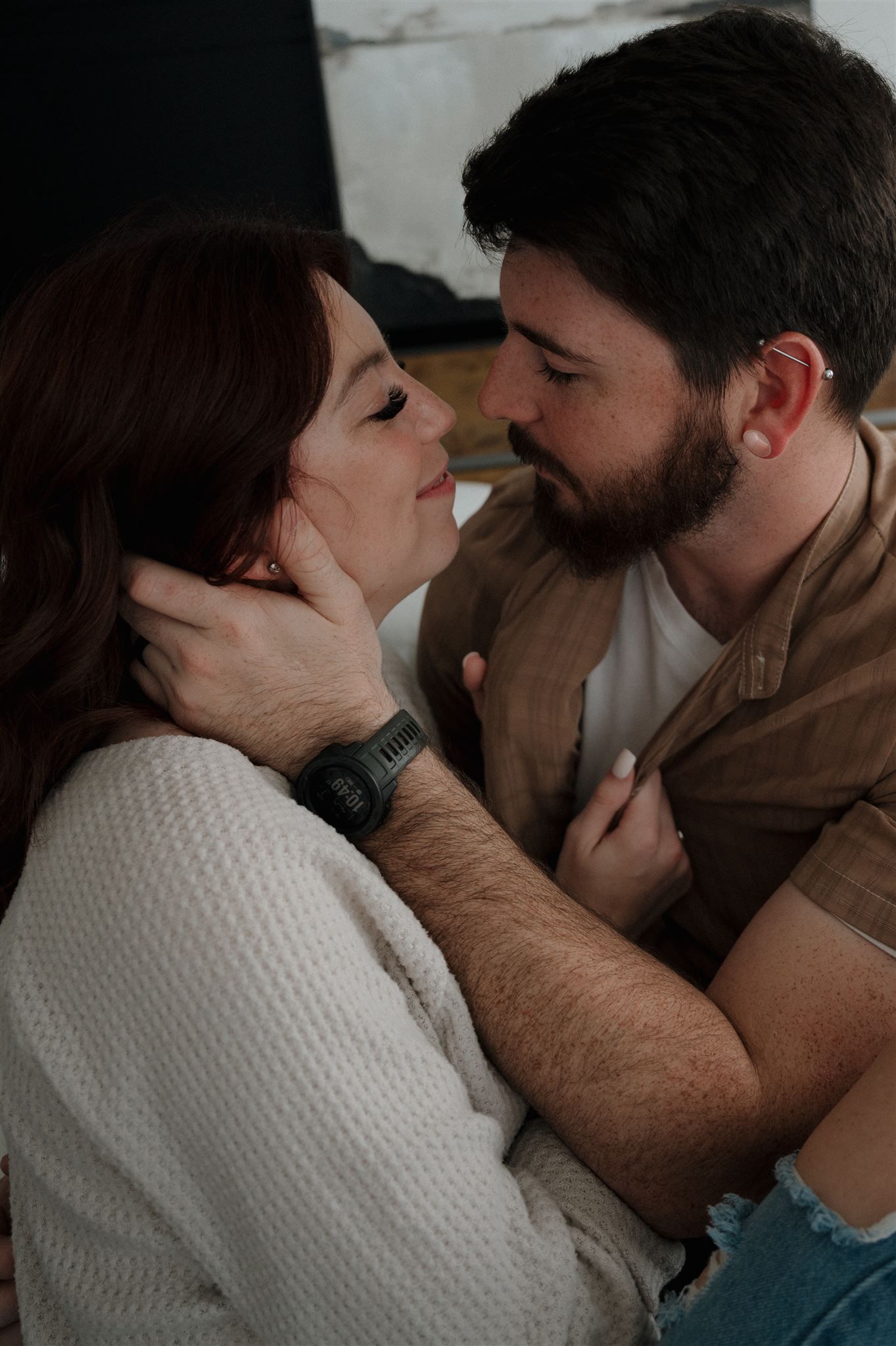 An intimate close-up of a couple sharing a tender moment together.
