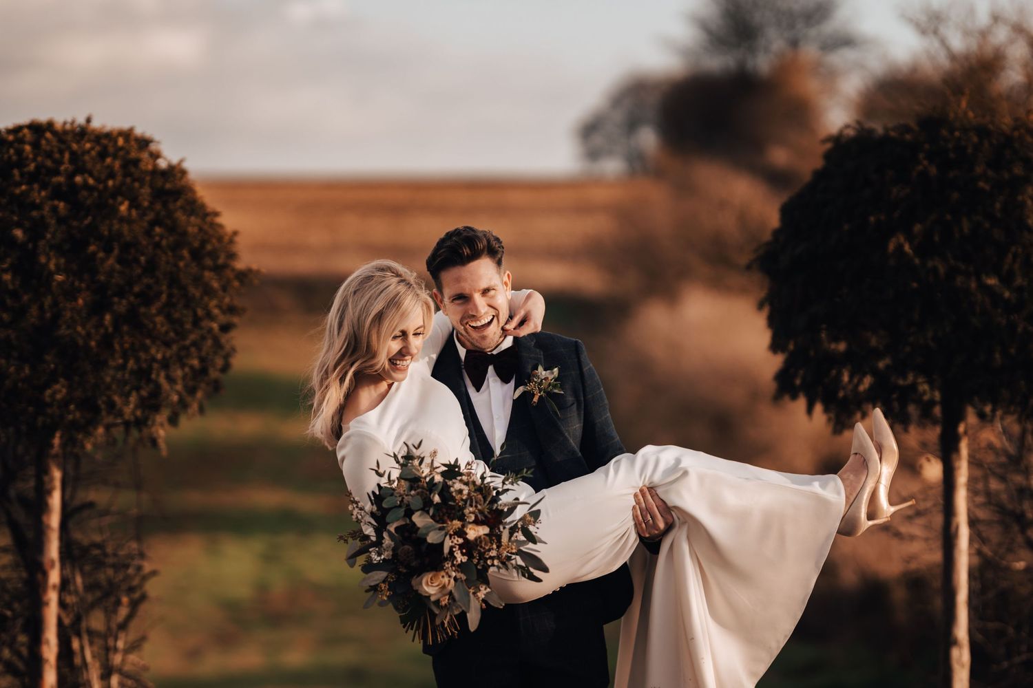 Bride and Groom having fun at Cripps Stone Barn in the Cotswolds