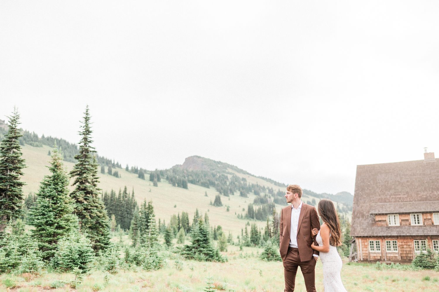Wedding couple exploring Mt. Rainier National Park. Photo by Pine + Vow.