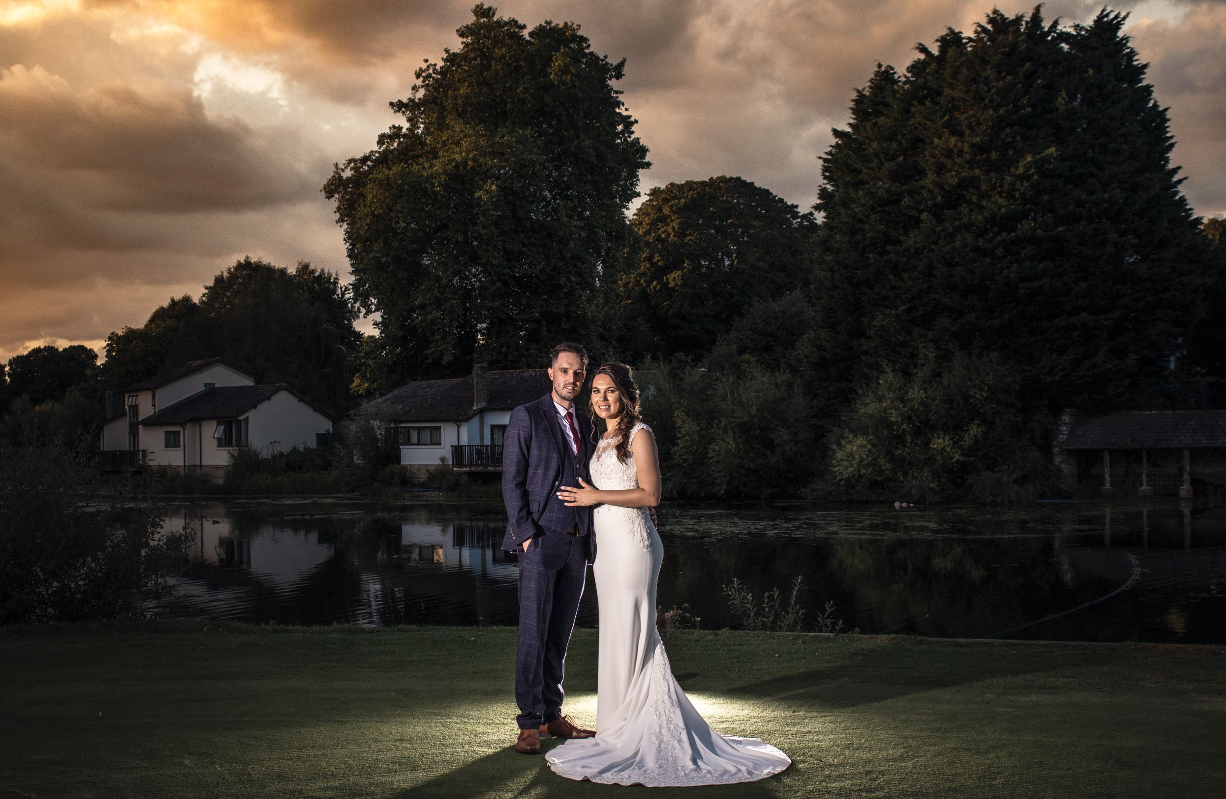 Panoramic sunset wedding photo series with dramatic orange sky and tree silhouettes.