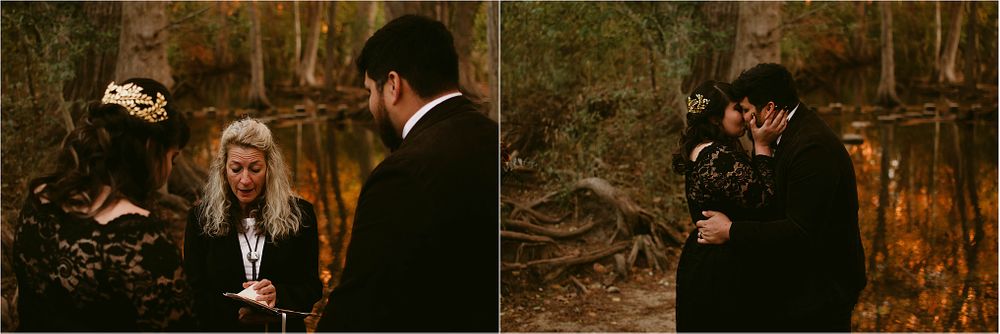 A tender moment captured during a woodland wedding ceremony with autumn colors.
