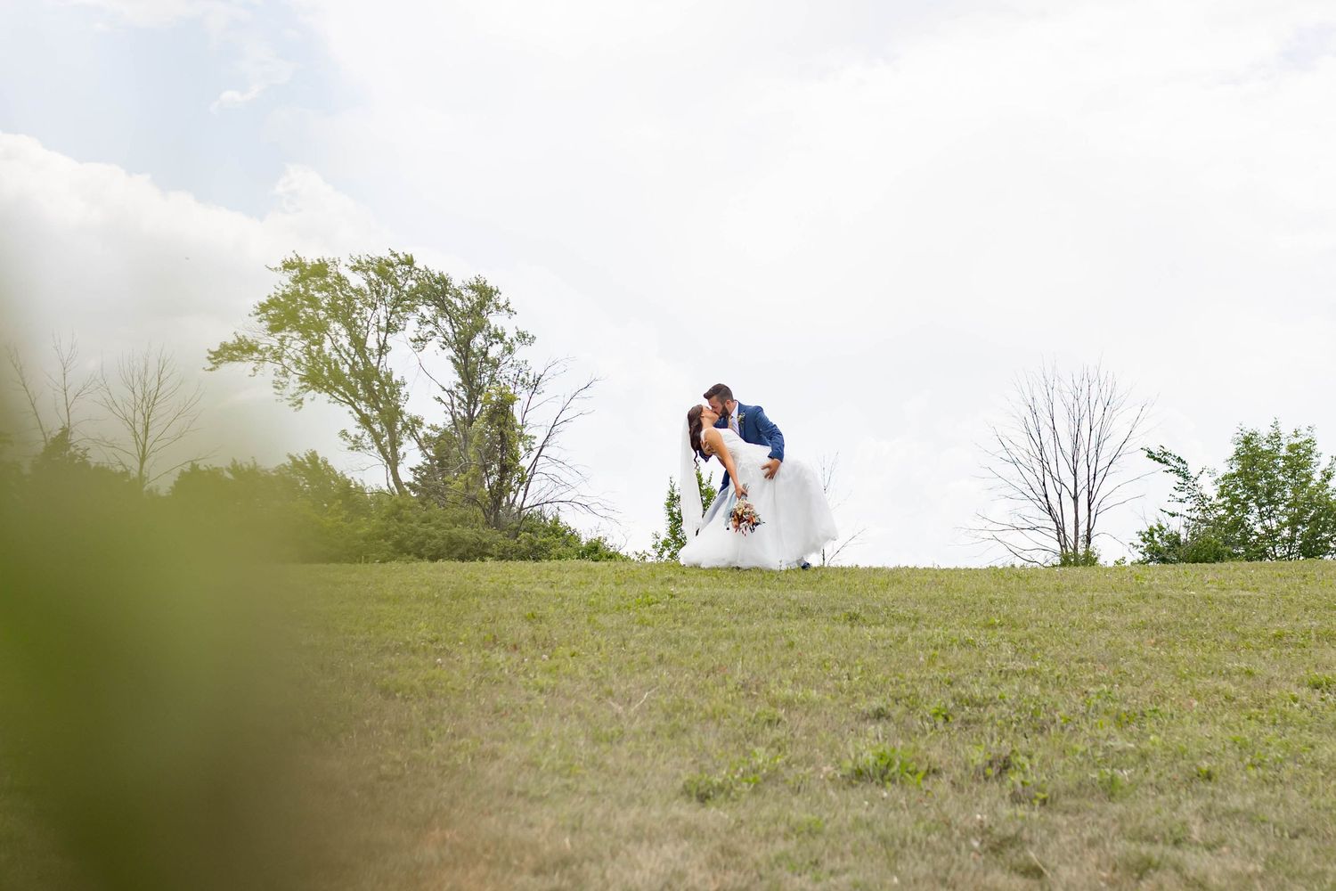 bride and groom kiss