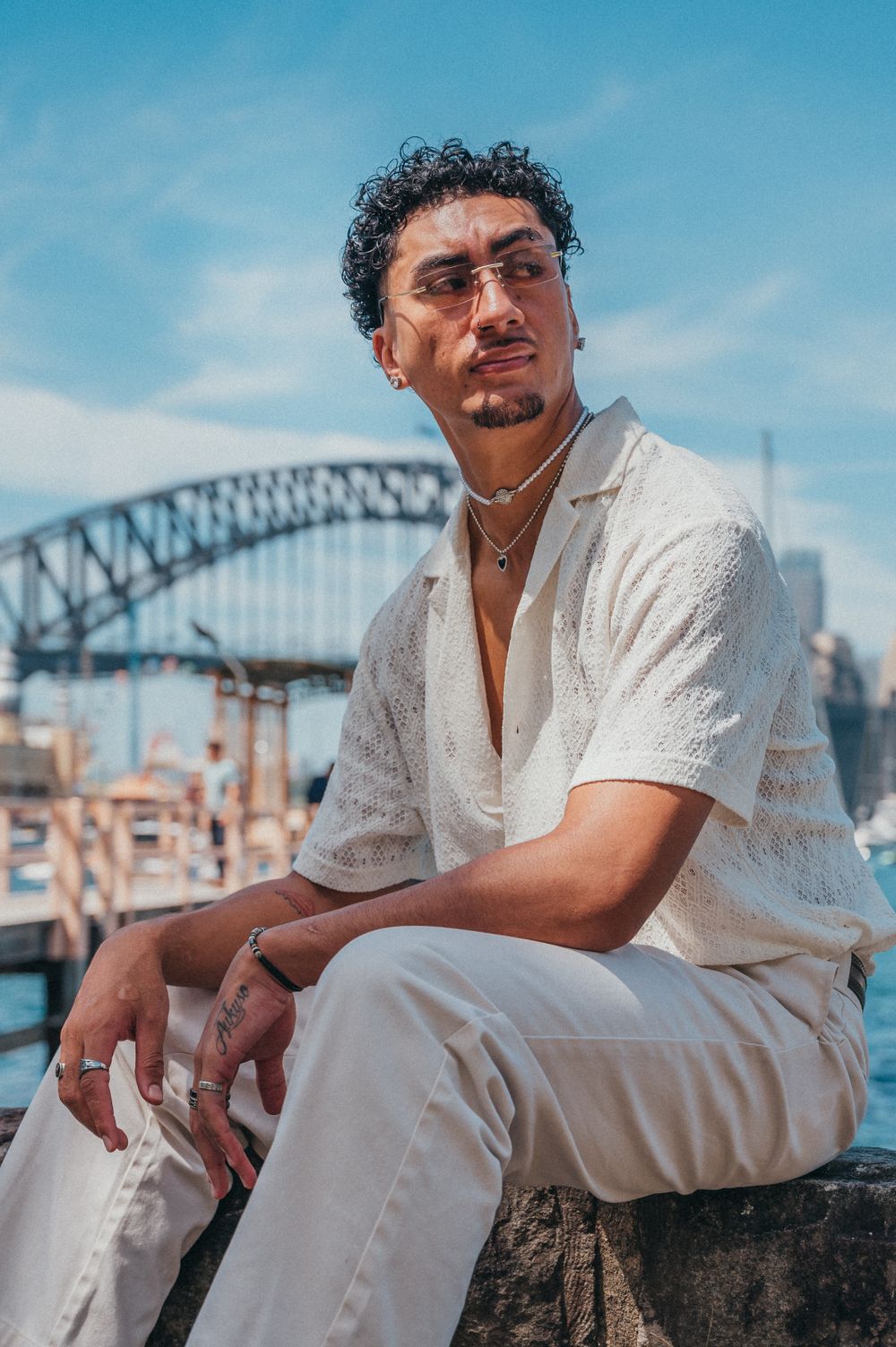 A casual portrait with Sydney Harbour Bridge in the background on a sunny day. SIX84 Photography, Portrait Photography, Sydney