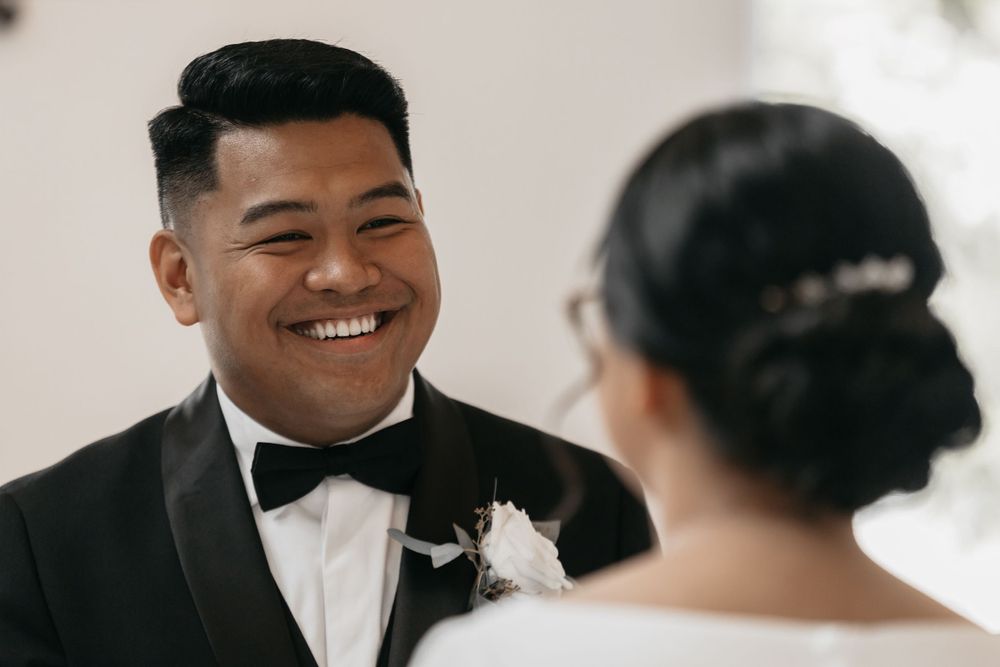 Natural light bright chapel wedding bride and groom exit natural green and white flowers